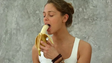 woman eating banana picture