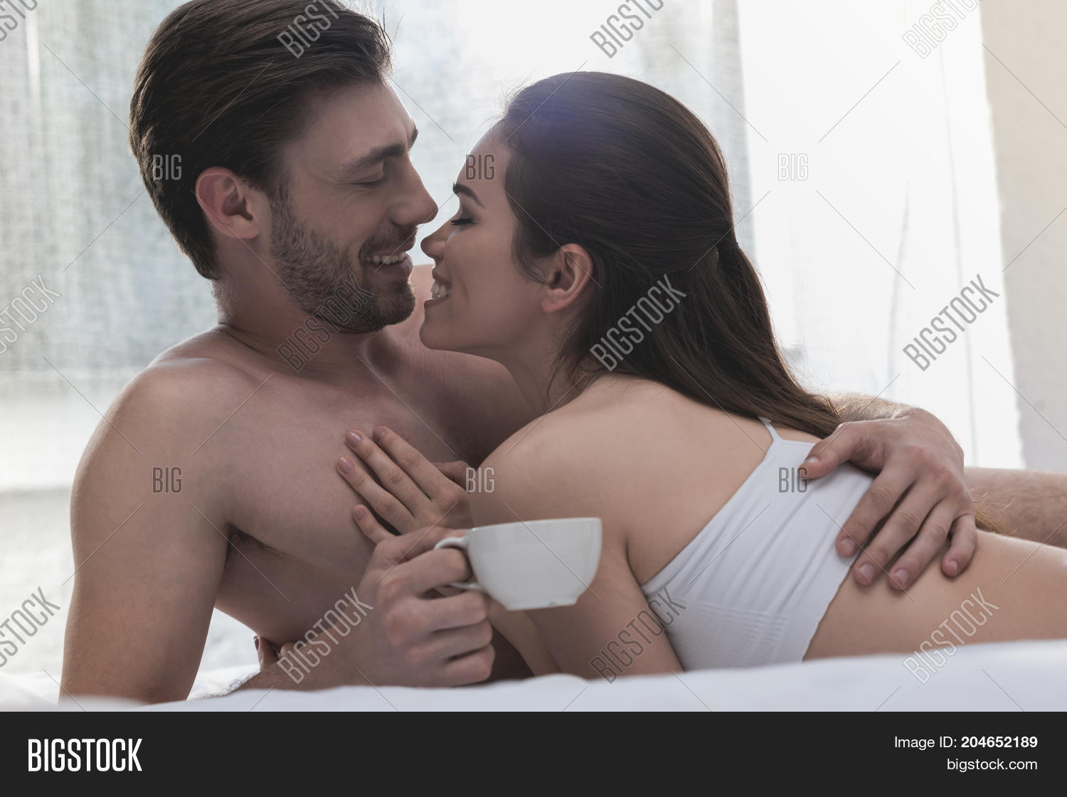 images of couples cuddling in bed