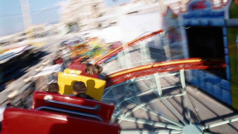 girl on roller coaster loses shirt