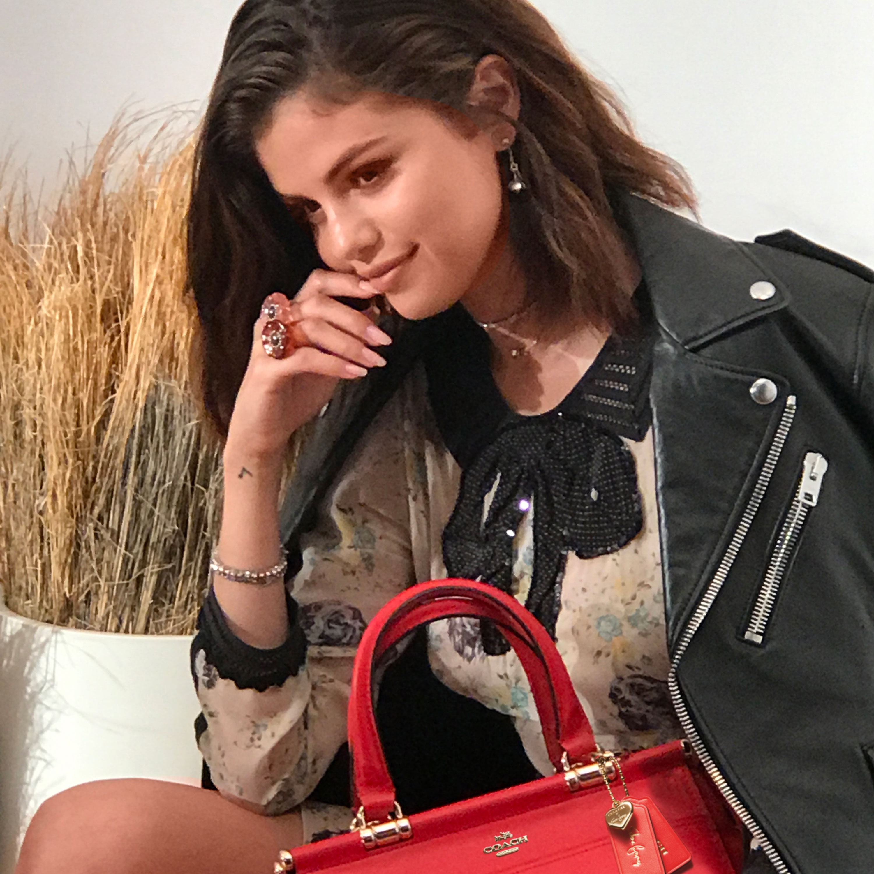 beth holan recommends selena gomez red leather pic