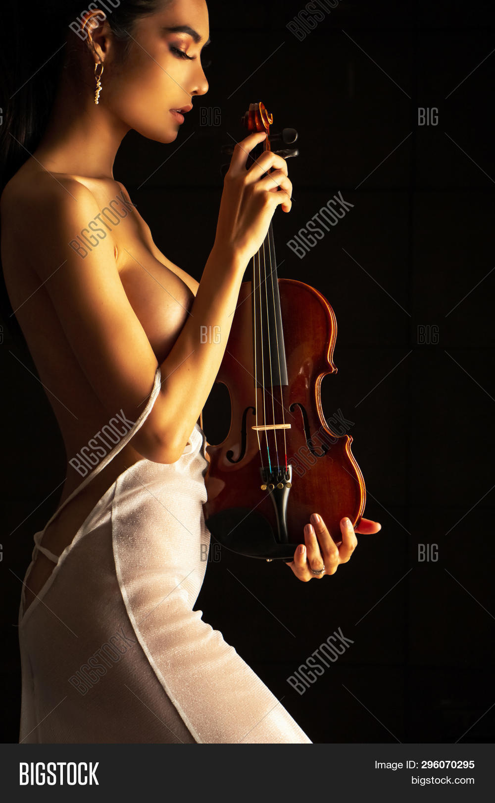 dee hardy add nude woman playing the violin photo