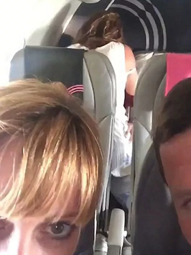 people having sex on a plane